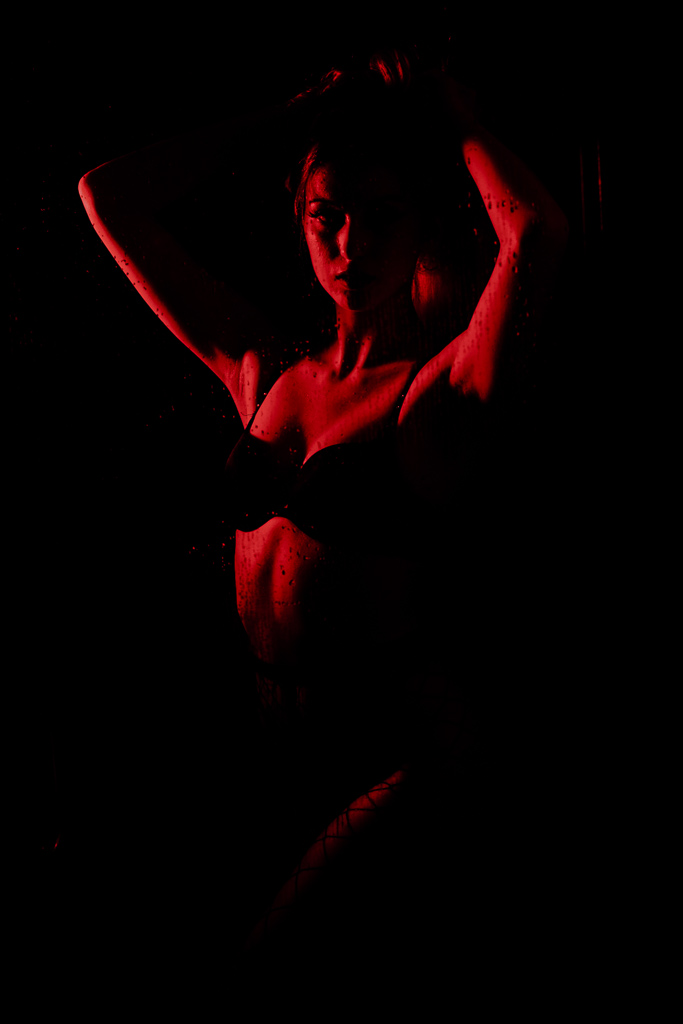 Topless Shows In Las Vegas girl in a faint red light in las vegas perfomring