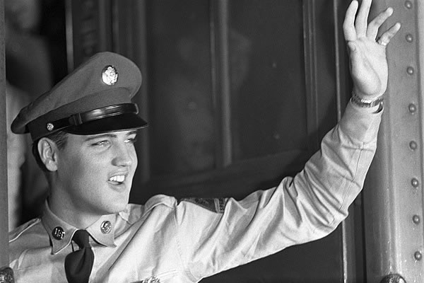 Elvis in Army Uniform Waiving