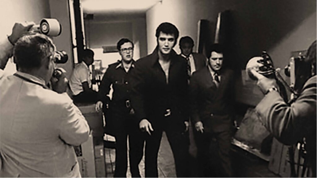 Elvis Walking Down the Hallway